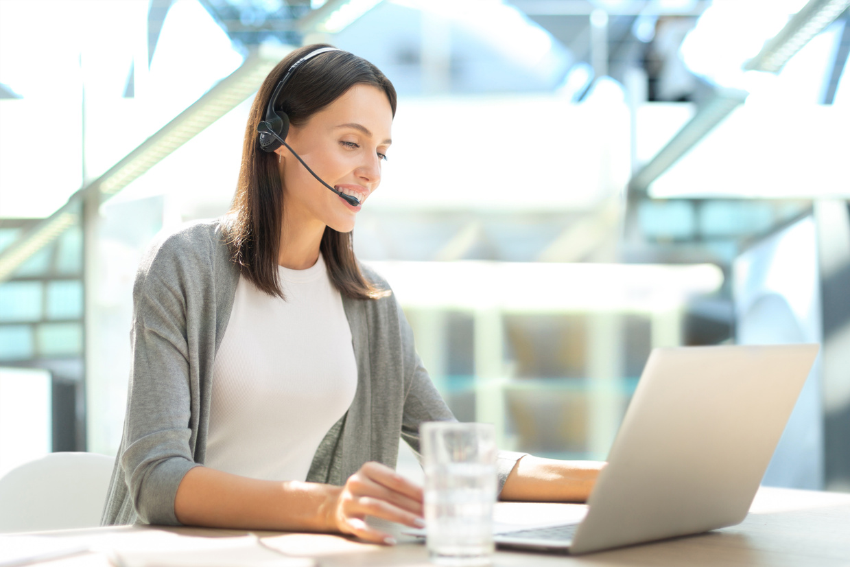 Customer support operator working in a call center office